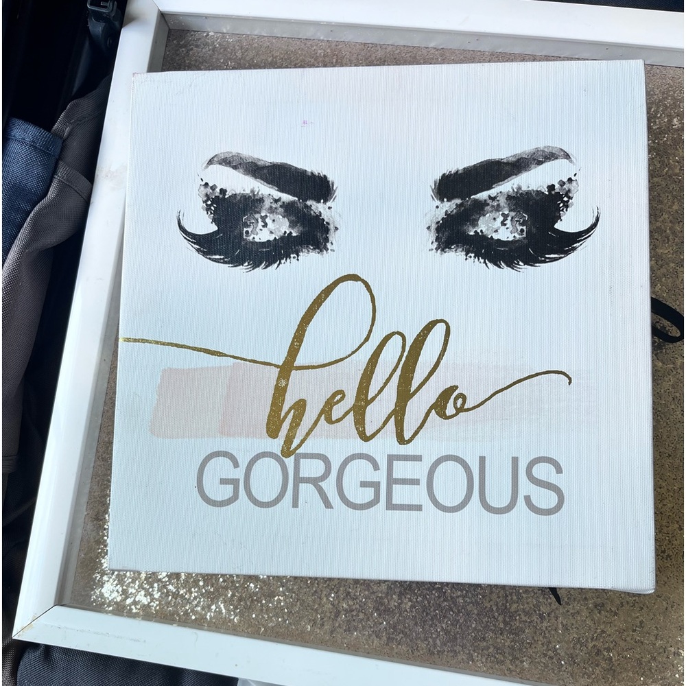 Coco Chanel original art and sparkly women’s room pictures. .